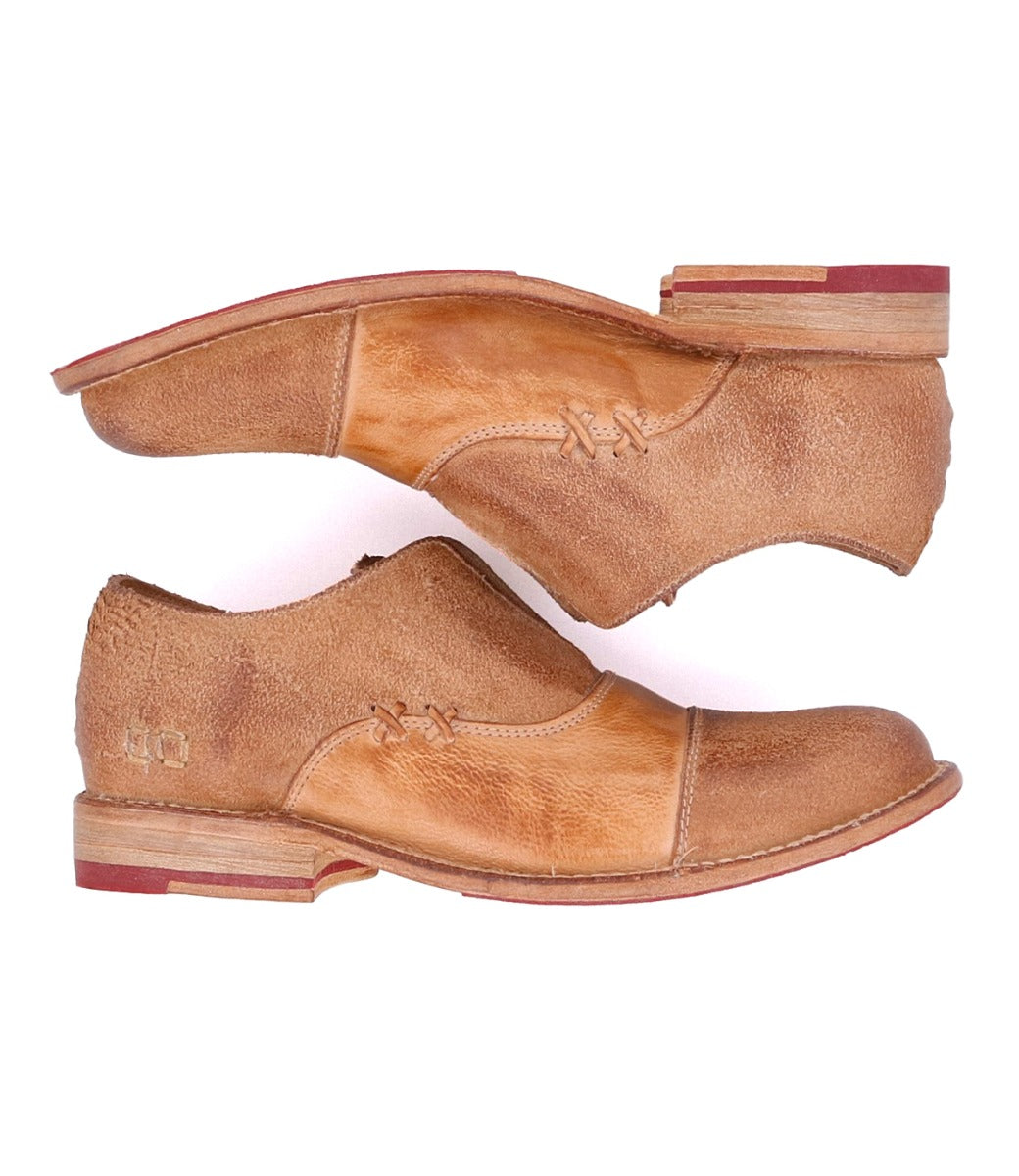 A pair of Garden M shoes by Bed Stu with red soles.