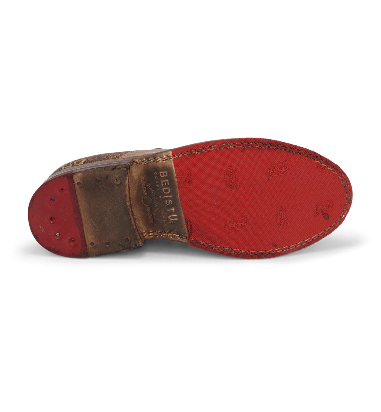 A pair of Garden M shoes by Bed Stu with red soles on a white background.