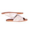 A pair of Gia white leather slide on sandals by Bed Stu.