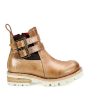 The Ginger II ankle boot by Bed Stu, featuring a tan leather finish, white sole, side buckle straps, an inner zipper, and a pull tab at the back, adds stylish touches.