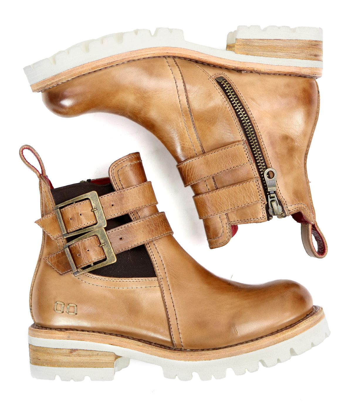 The Ginger II by Bed Stu are a pair of tan leather Chelsea ankle boots featuring inner zippers, buckle straps, and white rubber soles for stylish touches.