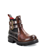 The Ginger II by Bed Stu is a brown leather Chelsea ankle boot featuring two buckle straps, an inner zipper, and a rugged black sole.
