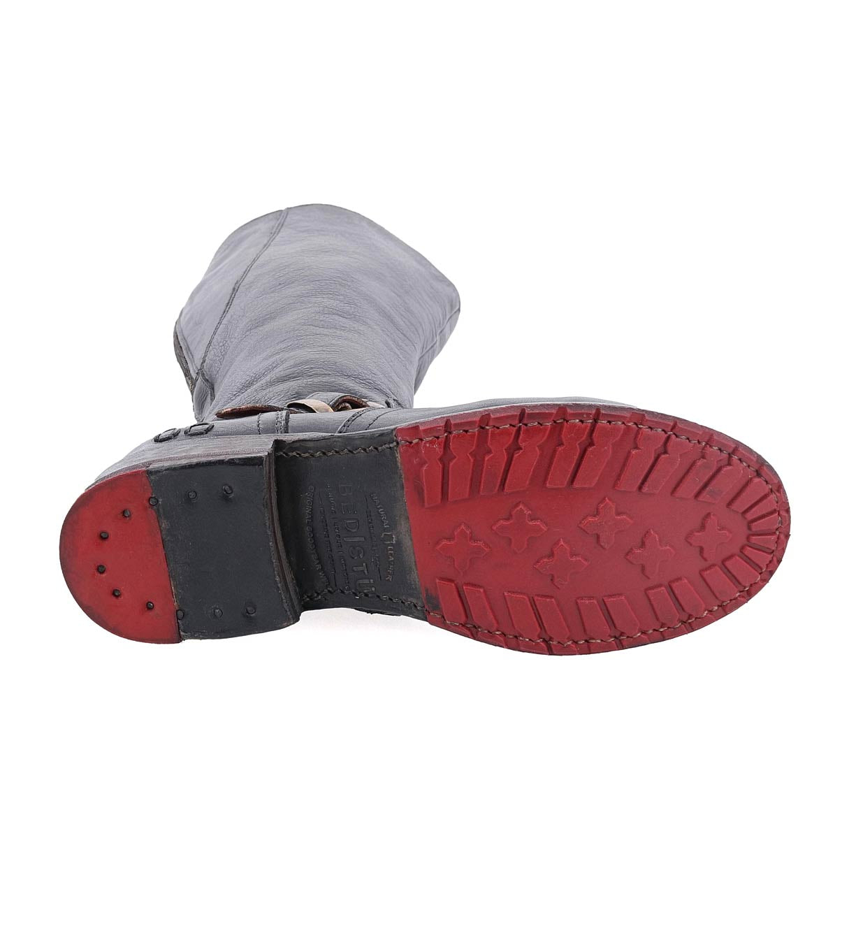 A pair of Bed Stu Glaye Wide Calf women's boots with red soles on a white background.