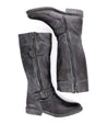 A pair of Bed Stu Gogo Lug women's boots with buckles and zippers.
