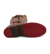 A pair of Gogo Lug Wide Calf brown leather boots with red soles by Bed Stu.
