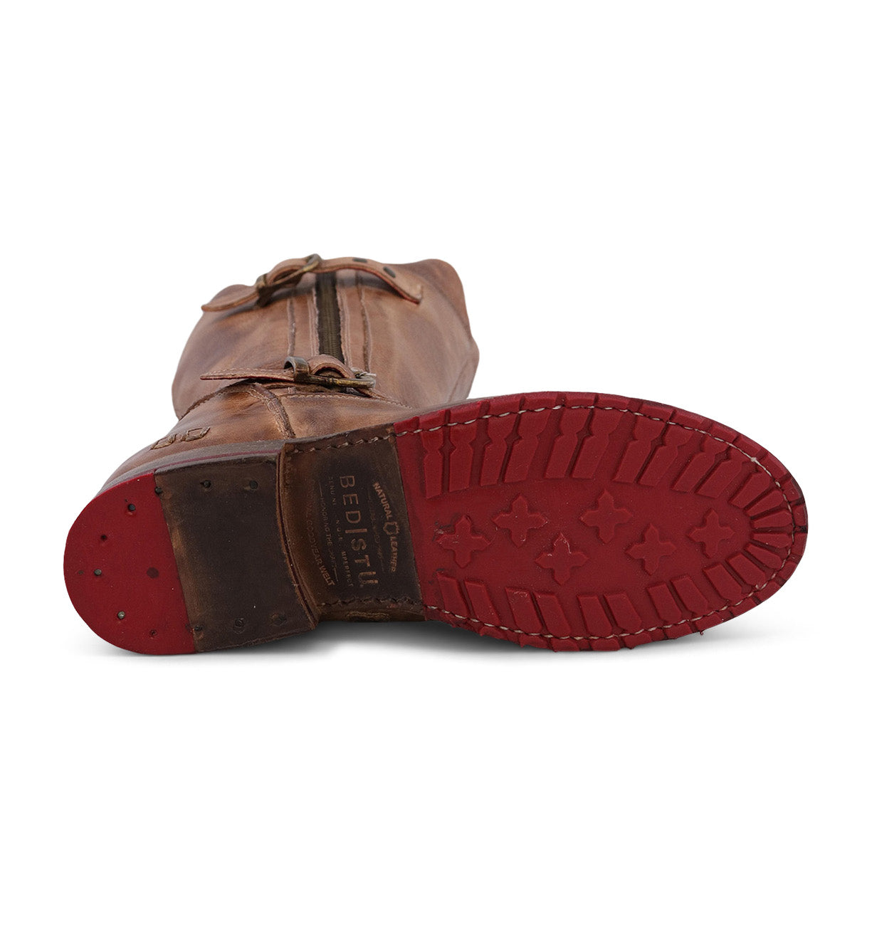 A pair of Gogo Lug Wide Calf brown leather boots with red soles by Bed Stu.