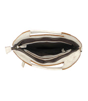 Inside a White and Brown Bed Stu Bag.