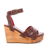 A women's Bed Stu Grettell wooden wedge sandal with straps and a wooden heel.