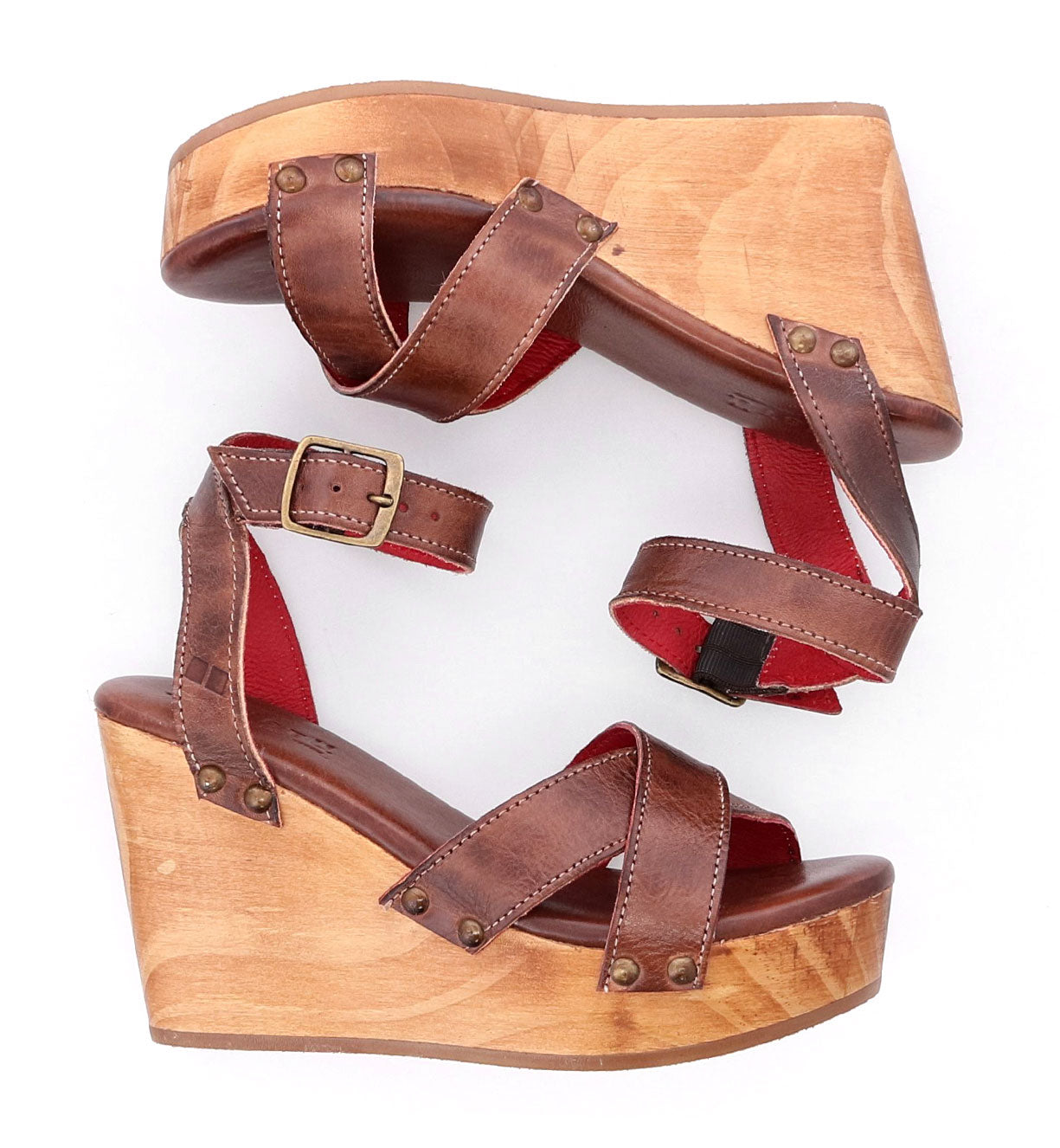 A pair of Grettell wooden wedge sandals with red straps from Bed Stu.