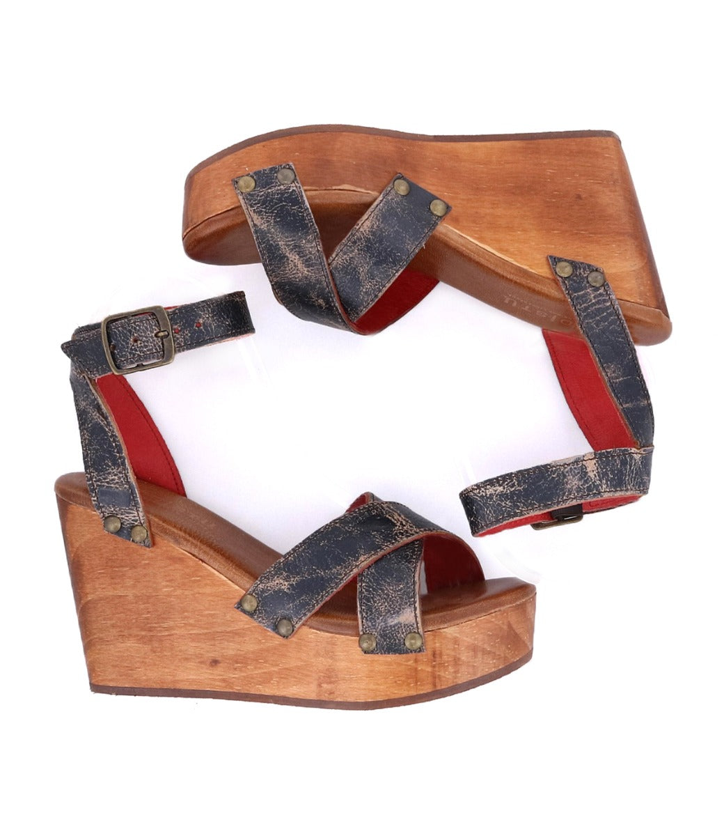 A pair of Bed Stu Grettell wedge sandals with red and black straps.