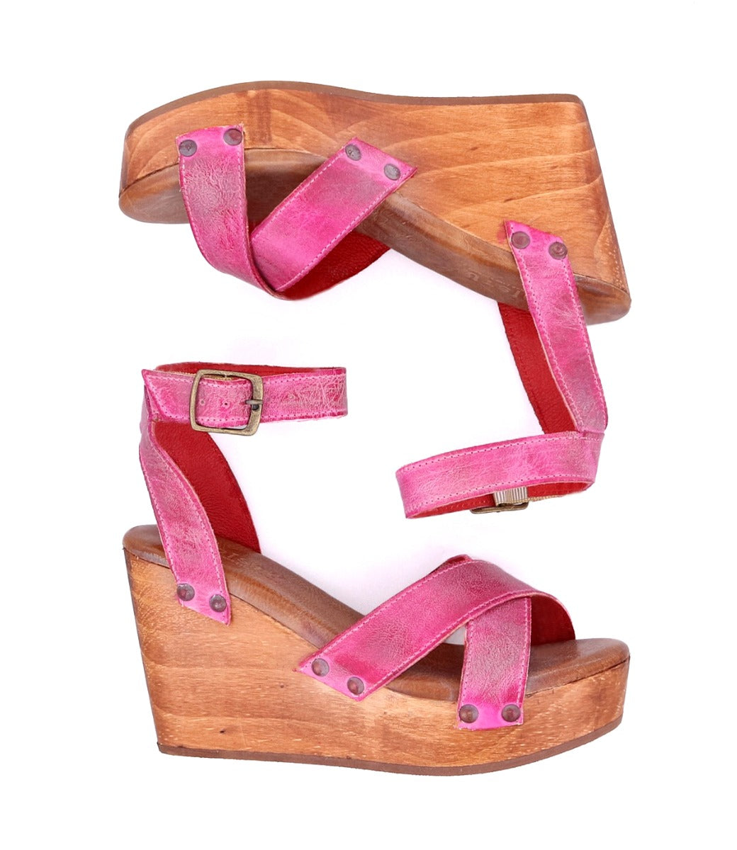 A pair of Bed Stu women's pink Grettell wedge sandals on a white background.