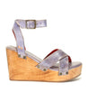 A women's sandal with a wooden platform and straps called Grettell by Bed Stu.