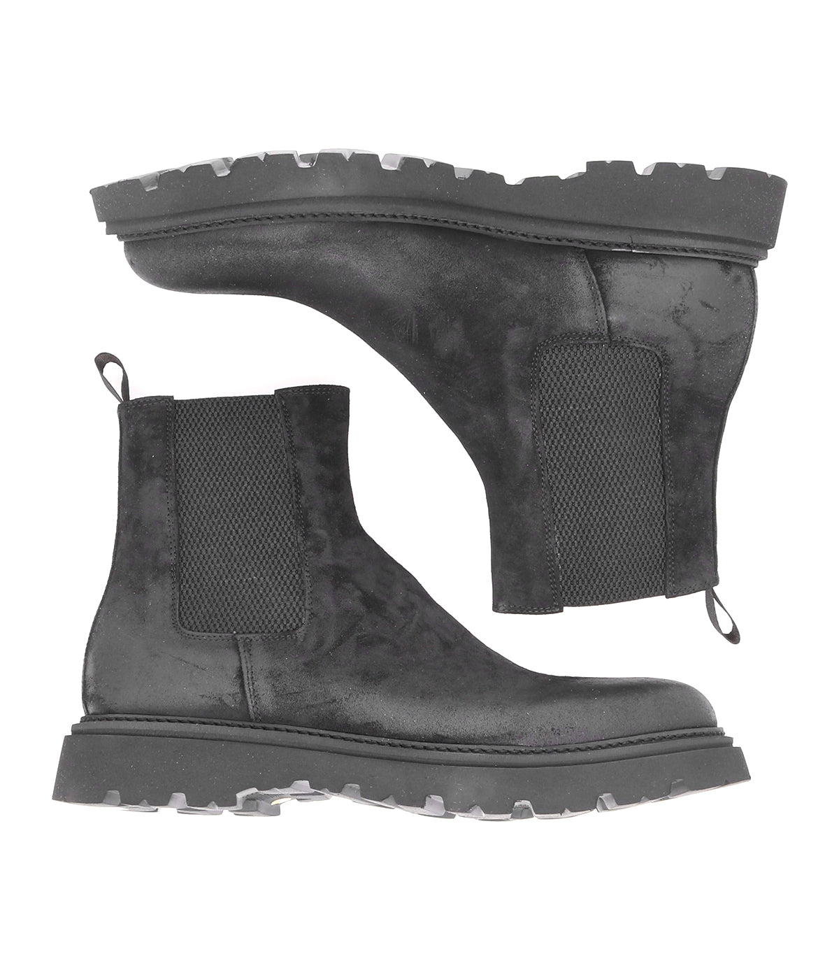 A pair of black Grit Chelsea boots from Bed Stu, showcasing casual elegance and enduring quality, positioned on a contrasting white background.