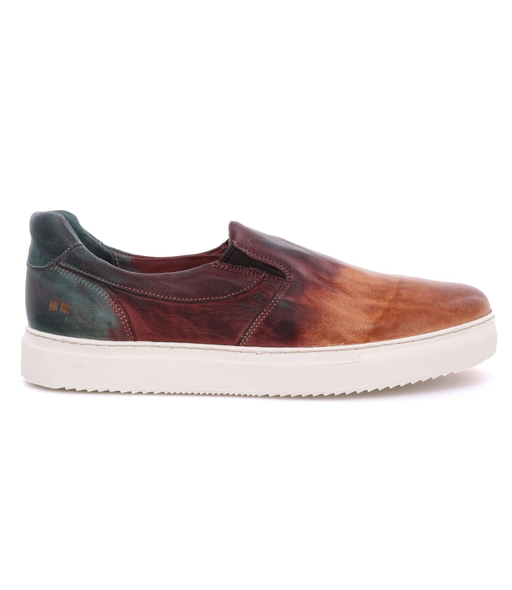 A men's slip on sneaker in a brown and green color, called the "Harry" by Bed Stu.