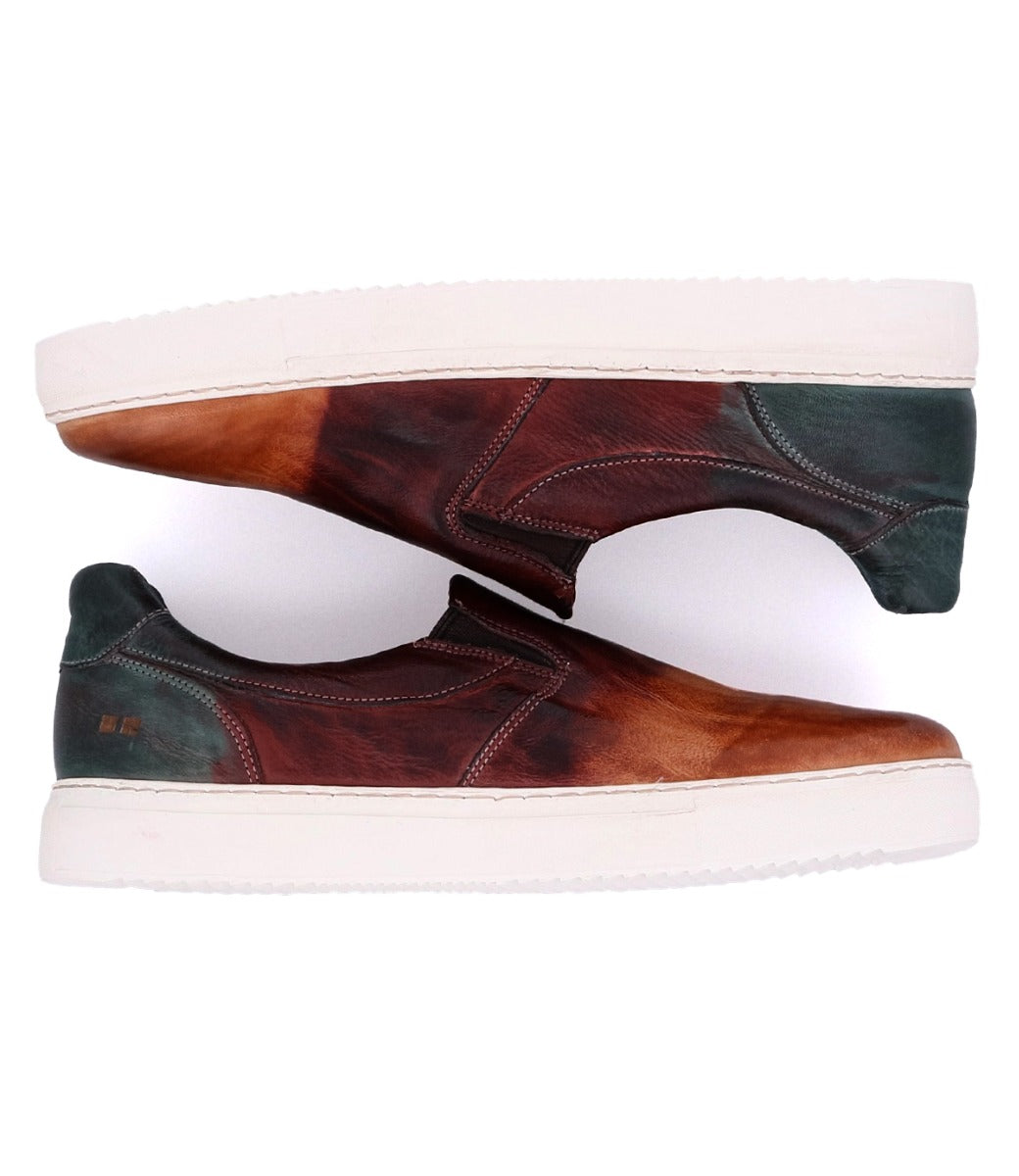 A pair of brown and green Harry slip on sneakers by Bed Stu.