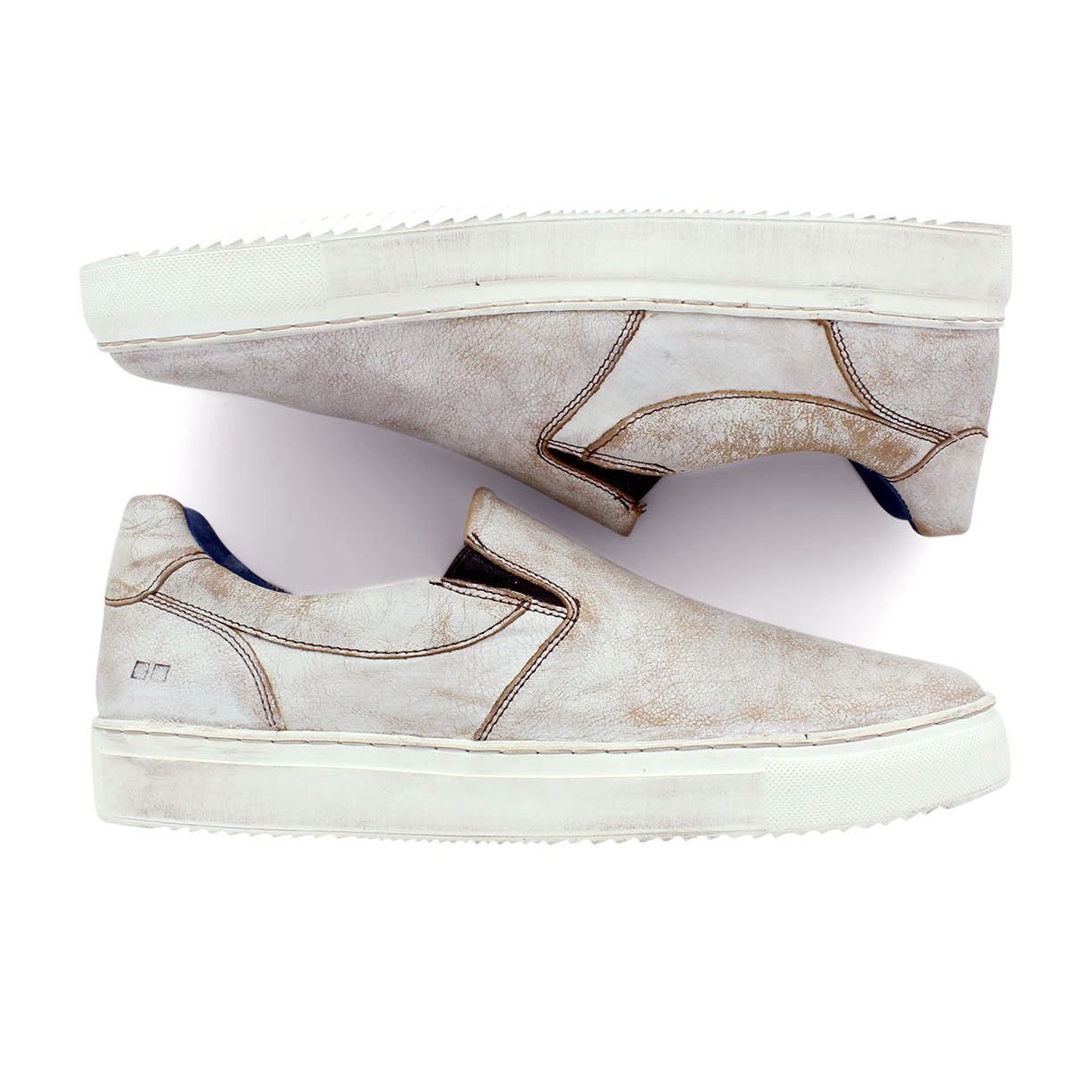 A pair of Harry slip on sneakers by Bed Stu on a white surface.