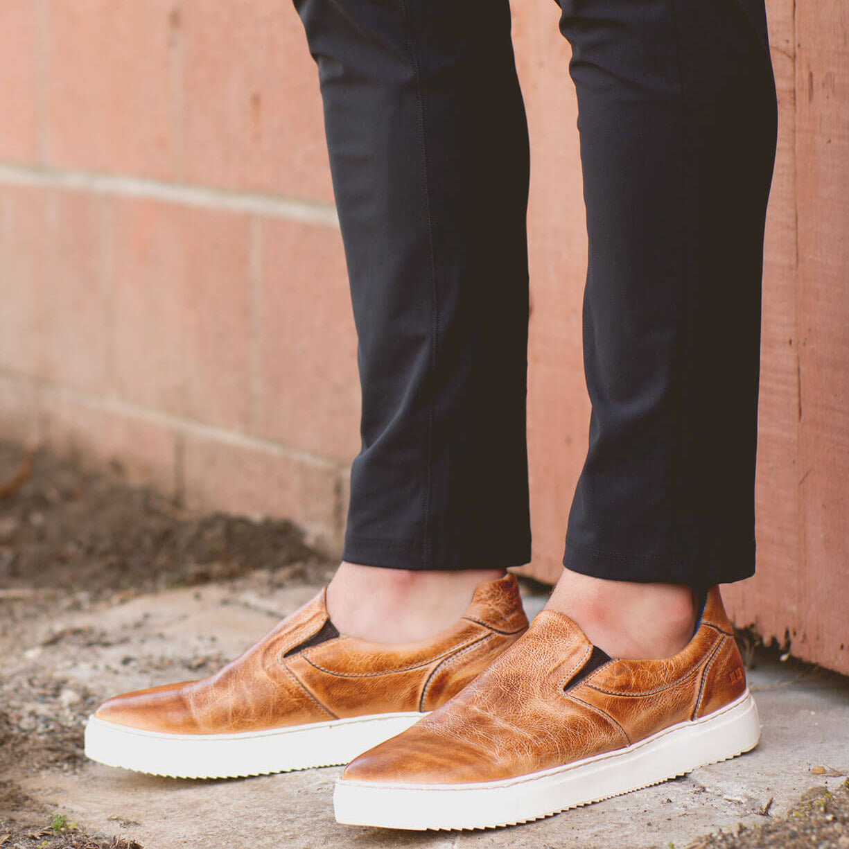 A man wearing a pair of Harry slip on sneakers by Bed Stu.