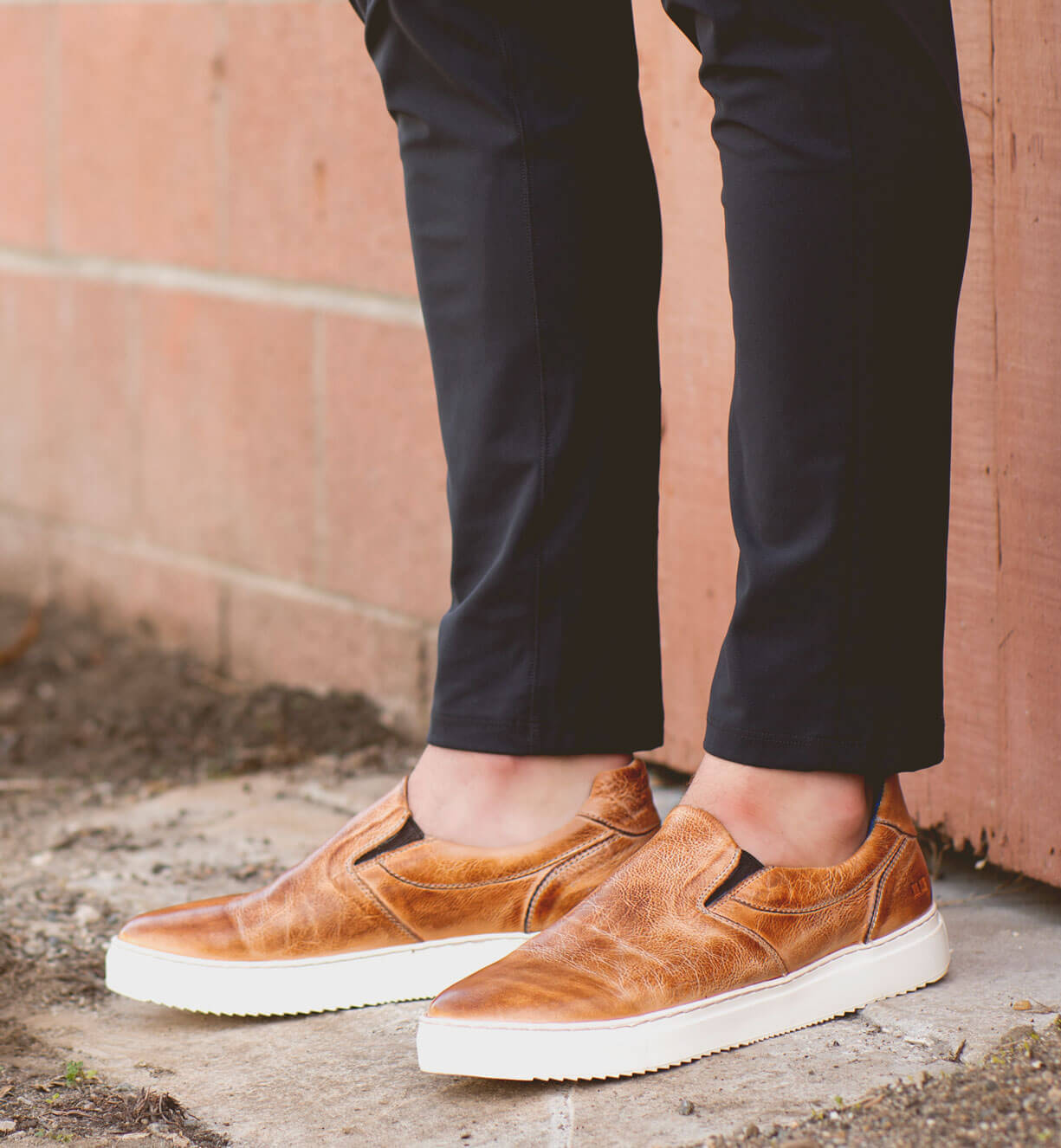 A man wearing a pair of Harry slip on sneakers by Bed Stu.