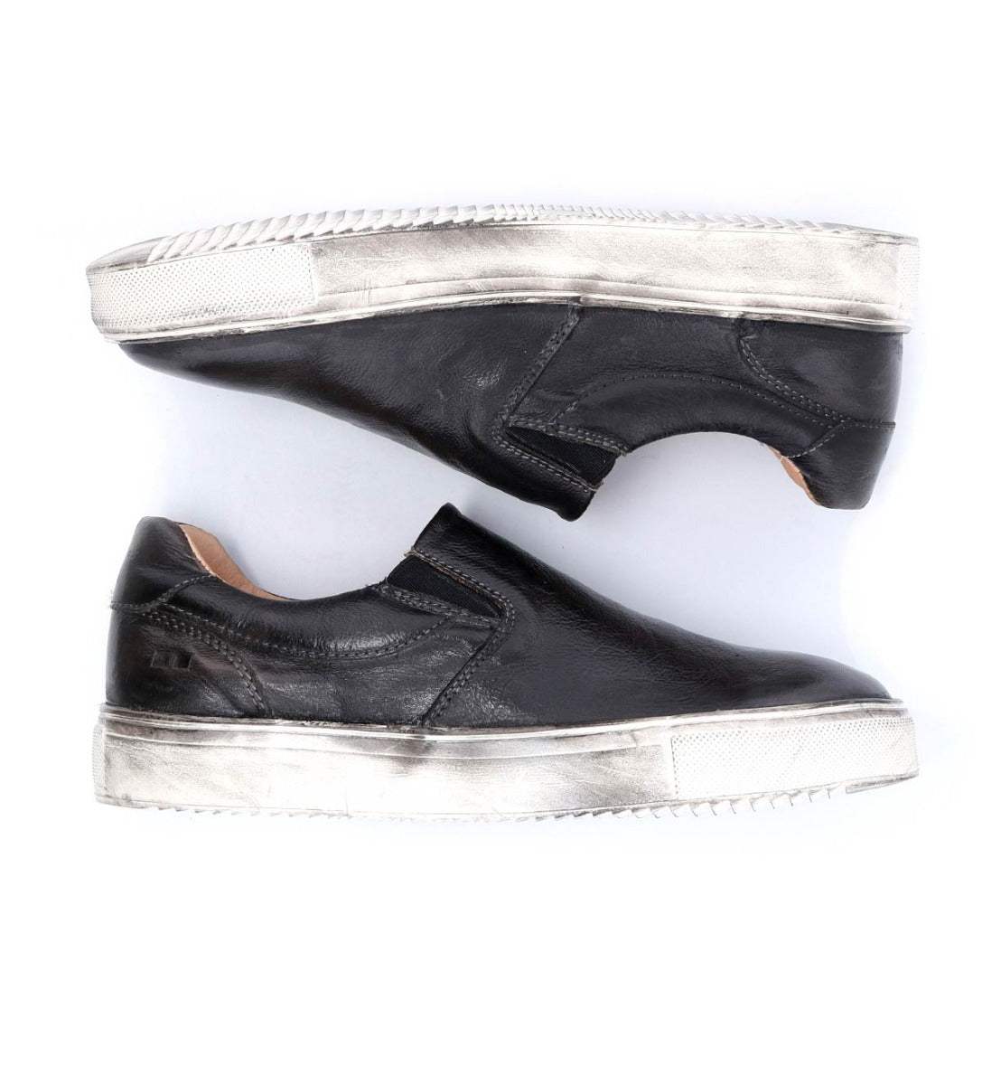 A pair of black leather slip on sneakers named Hermione by Bed Stu.