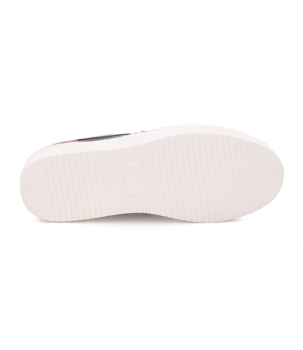 A white Hermione sneaker with a black sole by Bed Stu.