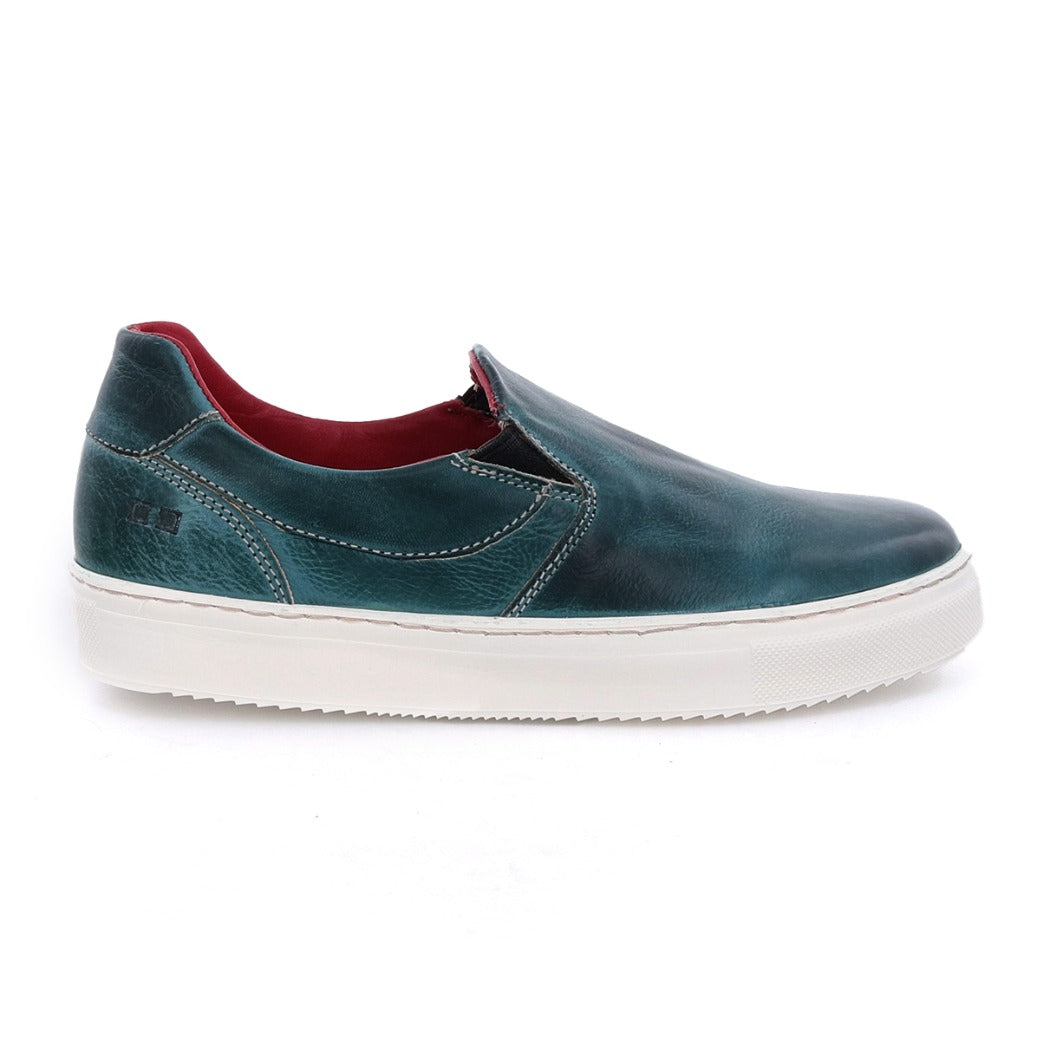 A women's blue slip on sneaker with a white sole named Hermione by Bed Stu.