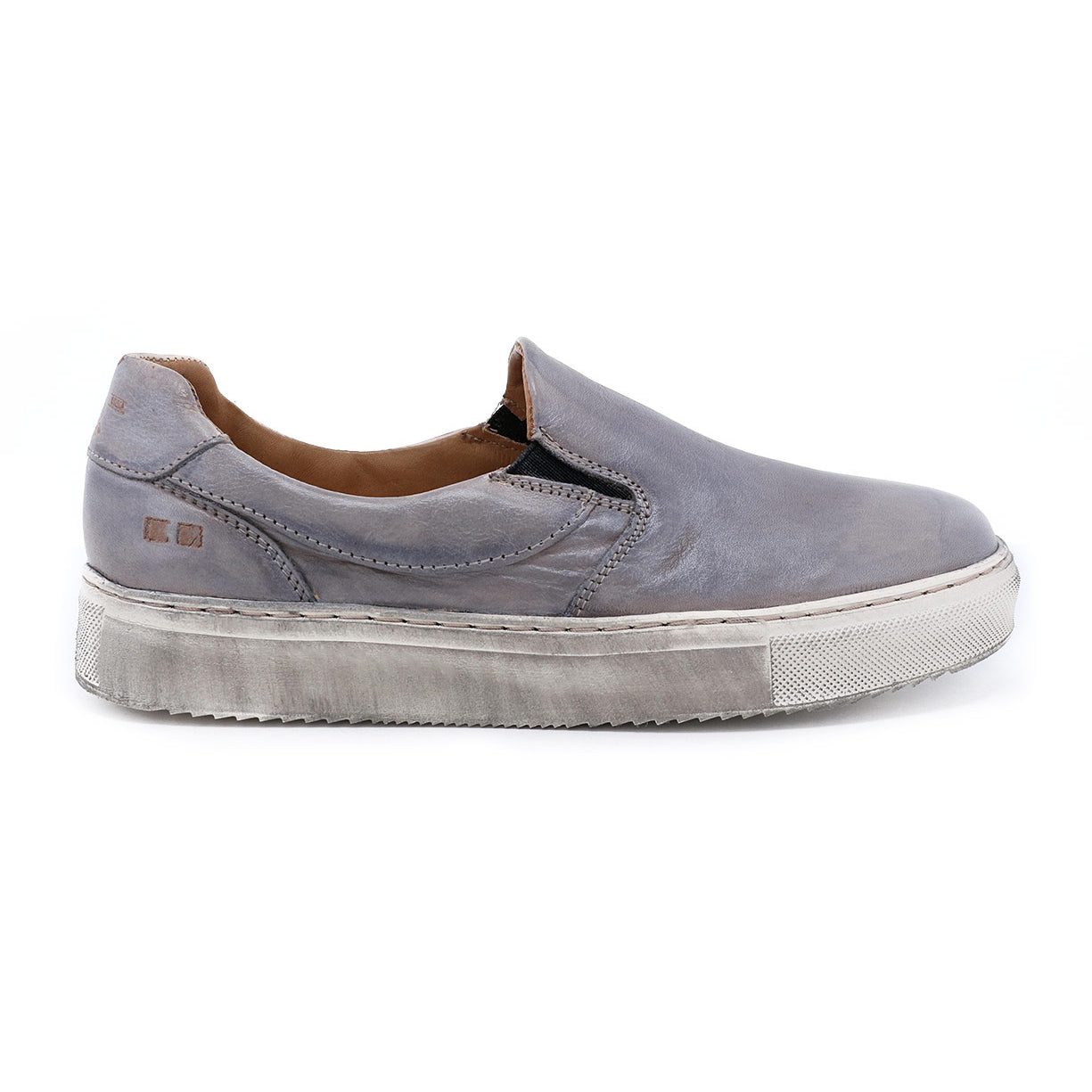 A grey slip on sneaker named Hermione by Bed Stu with a white sole.