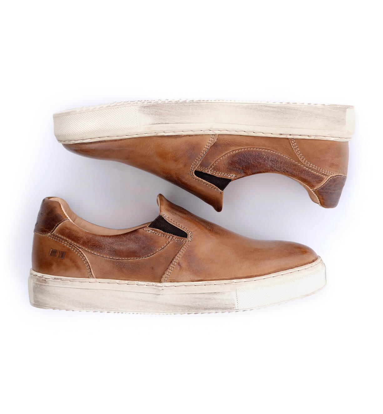 A pair of Bed Stu women's brown slip on sneakers named Hermione.