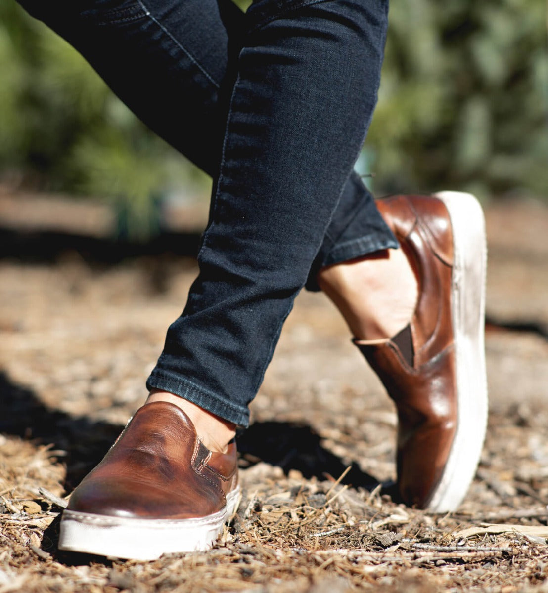 A woman wearing a pair of Bed Stu Hermione slip on shoes.