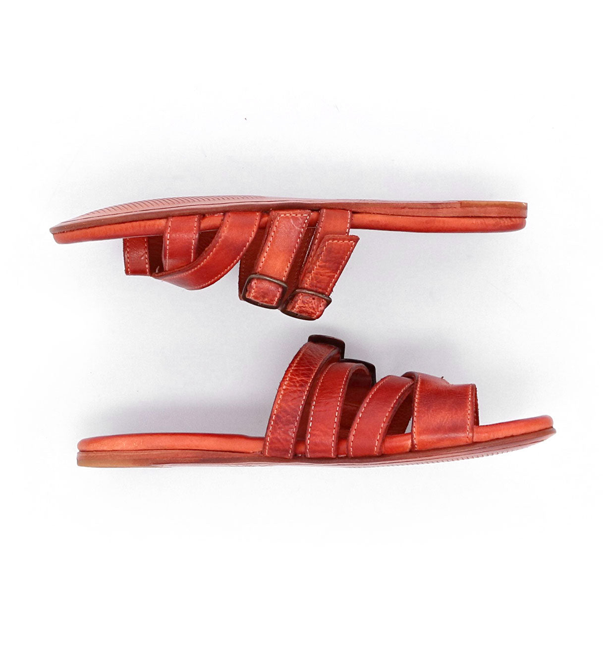 A pair of Bed Stu Hilda orange leather sandals.