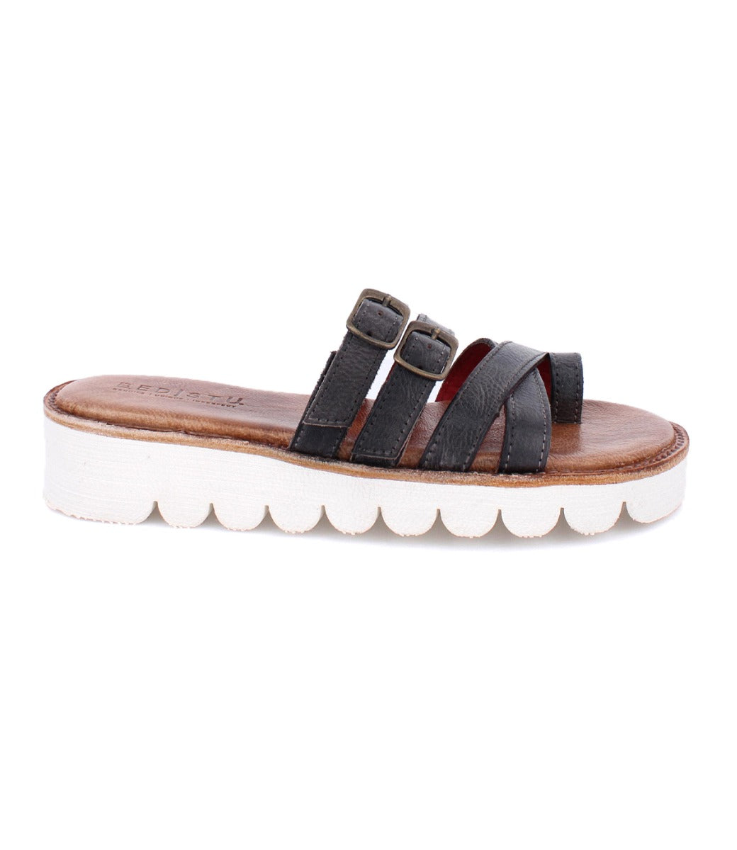 A women's black leather sandal with two buckles and a white sole, the Holland by Bed Stu.