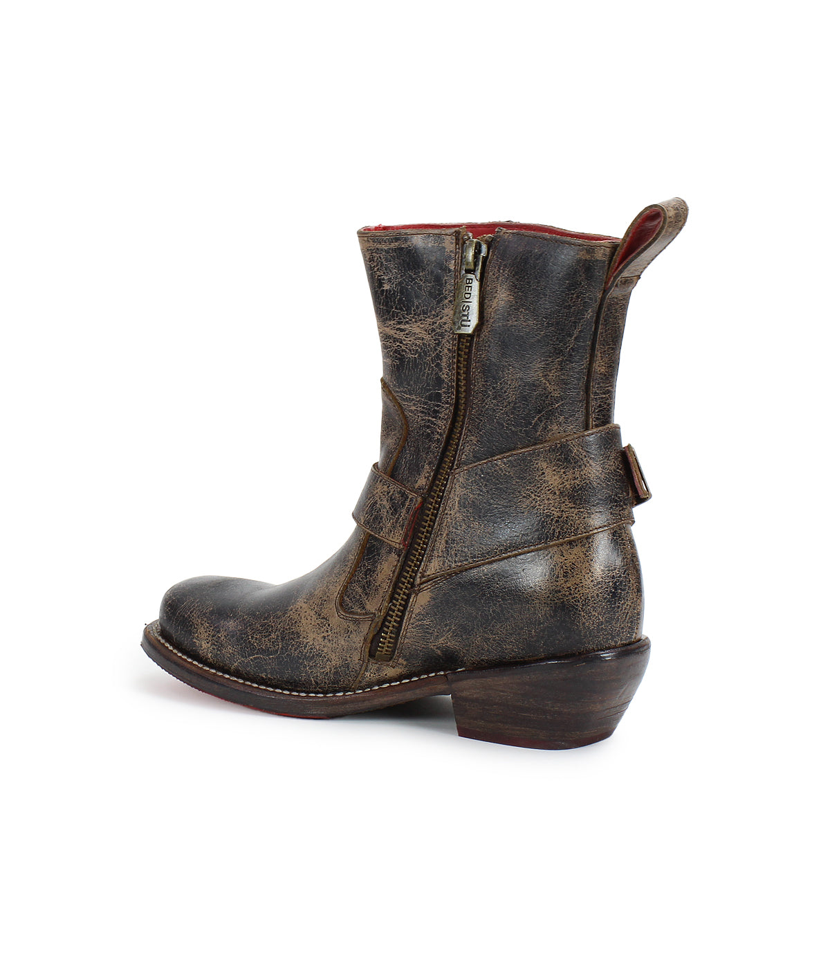 The Bed|Stü “Homage” is a distressed brown leather ankle boot featuring a square toe, side zipper, pull tab, and low stacked heel, shown in profile against a white background.