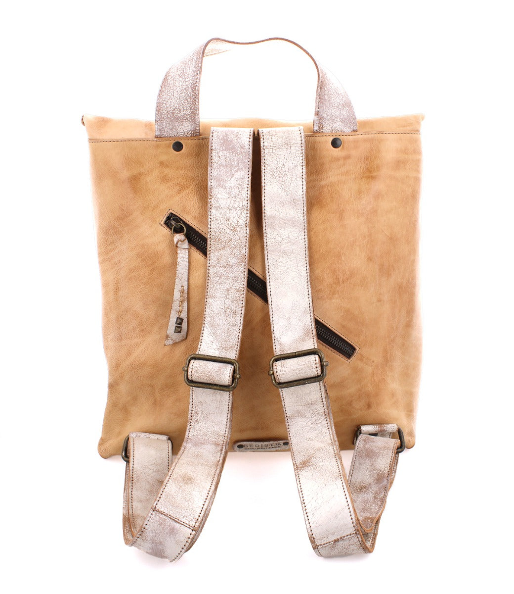 A beige leather Howie backpack with zippers and straps, made by Bed Stu.