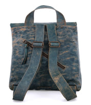 A Howie dark teal leather backpack with a zipper by Bed Stu.