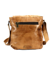 Introducing the "Hue" by Bed Stu, a brown leather crossbody bag featuring a zippered front pocket and an adjustable strap. This versatile bag, with the "Bed Stu" brand showcased at the bottom front, effortlessly doubles as a unisex messenger bag.
