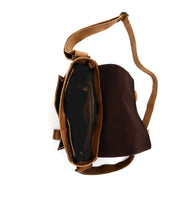 Top view of an open brown Hue messenger bag by Bed Stu, showcasing a spacious interior compartment and an adjustable strap designed for all genders.