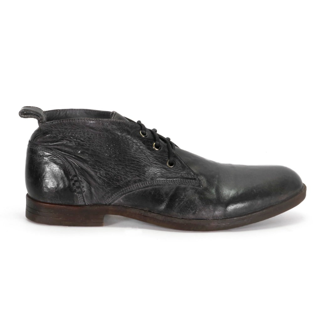 A single black leather Illiad dress shoe by Bed Stu, with a cushioned insole, displayed on a white background.