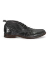 A pair of Bed Stu Illiad men's black leather shoes.