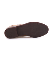 A close-up of the sole of a brown leather Bed Stu Illiad chukka boot, showcasing a smooth dark bottom with no visible tread pattern.