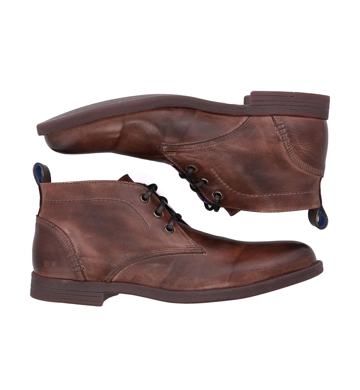 A pair of Bed Stu Illiad men's brown vegetable-tanned leather lace-up boots, displayed with one boot slightly above the other against a white background.