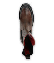 Top view of the Illicit boot from Bed Stu, featuring brown leather with a black sole and a red interior, exuding retro flair that adds nostalgic fashion vibes to any ensemble.