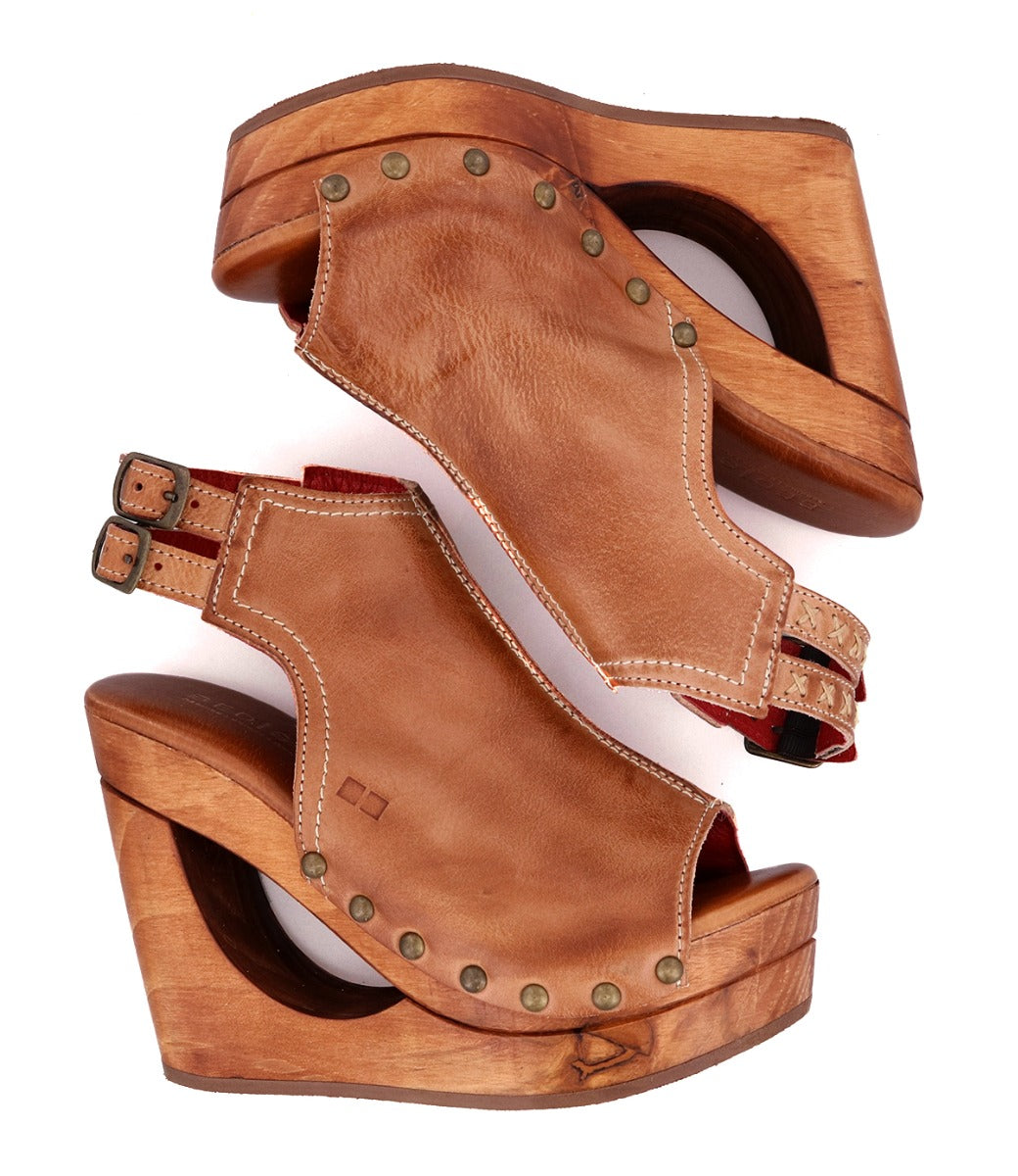 A pair of Imelda wooden sandals with a Bed Stu wooden heel.