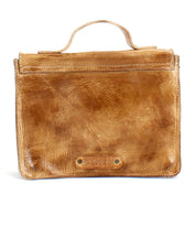 The Improv by Bed Stu is a brown leather handbag with a top handle and a textured surface. It boasts a rectangular shape that combines fashion and functionality, featuring an embossed logo on the bottom front. The bag also includes a detachable crossbody strap for versatile carrying options.