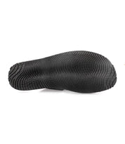 A pair of comfortable black rubber Bed Stu shoes on a white background.