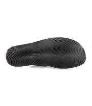 A pair of comfortable black rubber Bed Stu shoes on a white background.