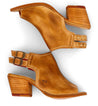 A pair of Bed Stu Ireni sandals with a wooden heel.