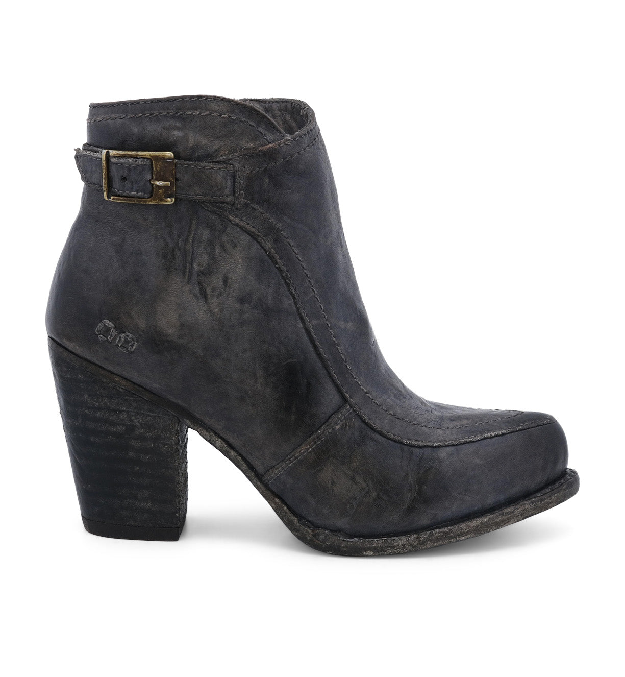 A single leather heeled ankle bootie with a vintage buckle accent against a white background. (Isla by Bed Stu)