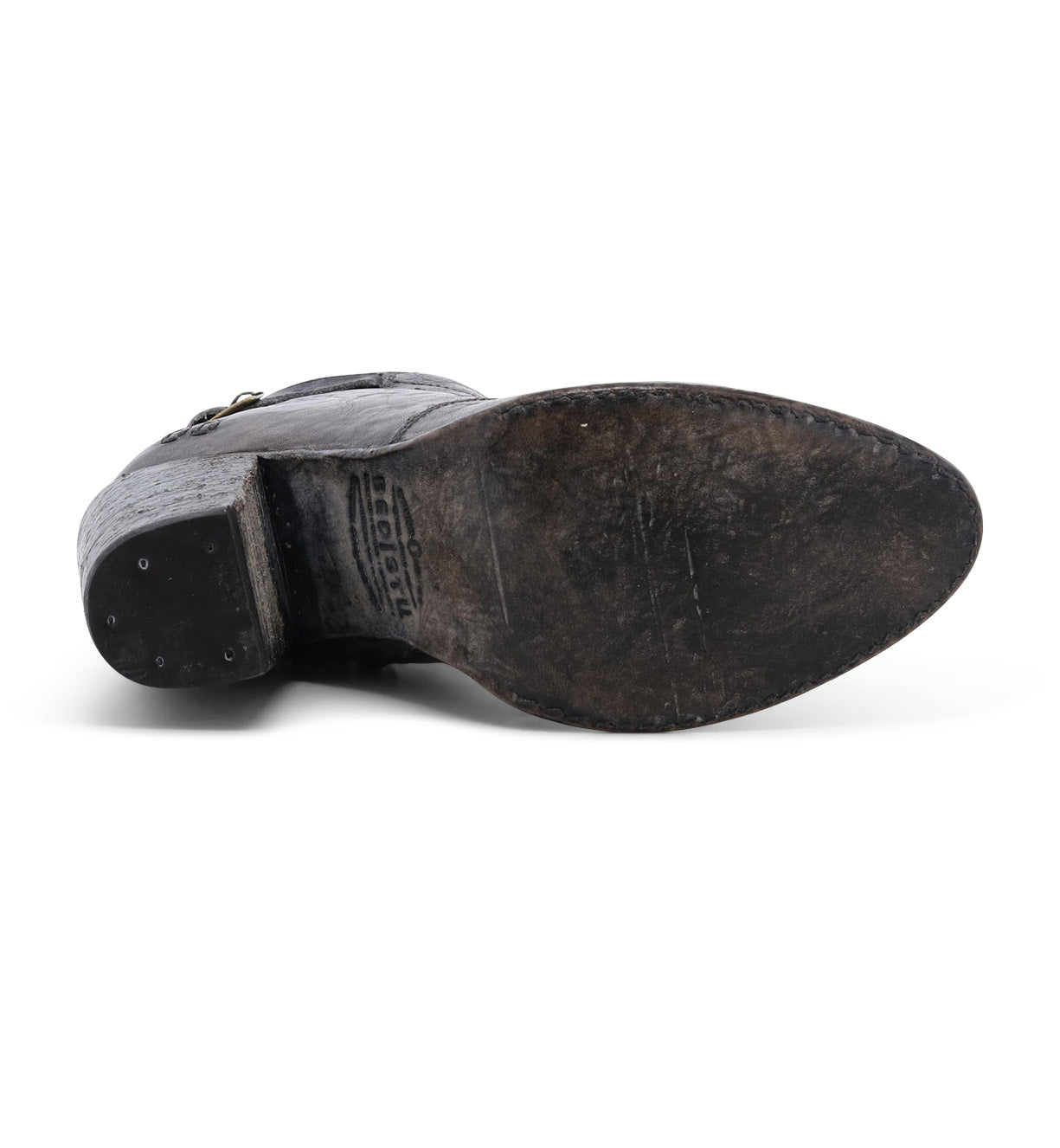 A worn-out Bed Stu Isla leather heeled bootie sole with visible scuff marks and signs of wear.