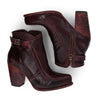 A pair of Bed Stu Isla women's burgundy leather ankle boots.