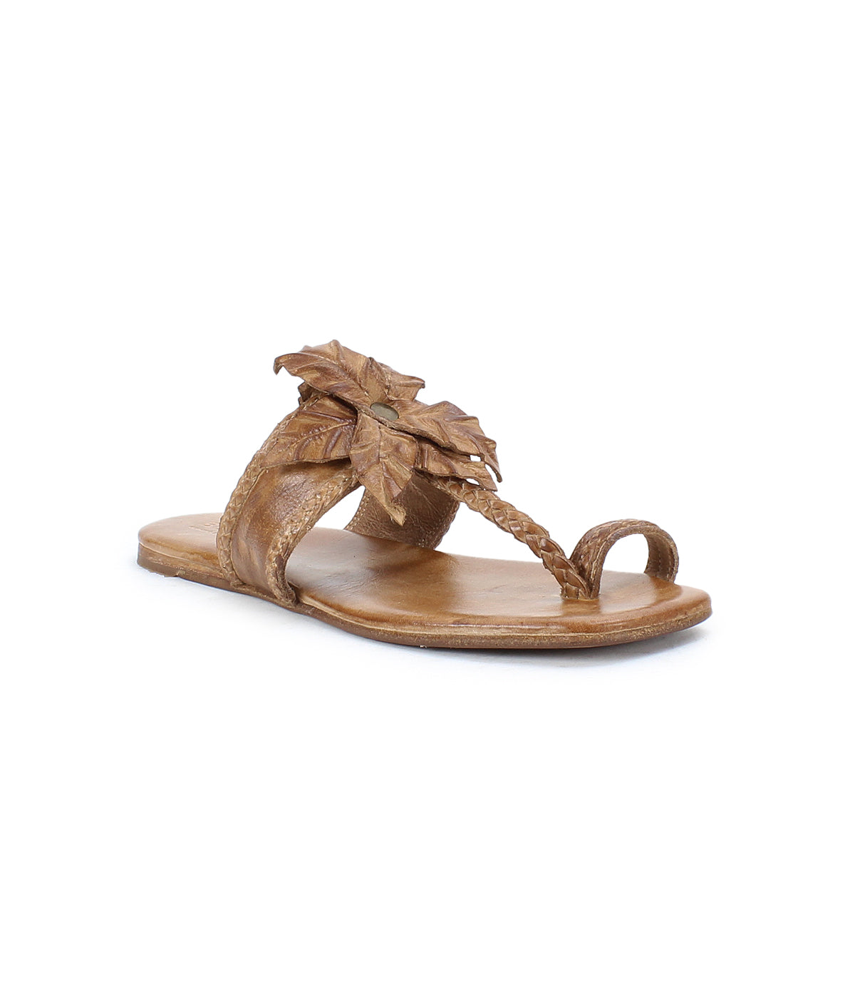 The Isobel by Bed Stu is a brown leather sandal featuring a toe loop, braided strap, and decorative leaf accents on the upper.
