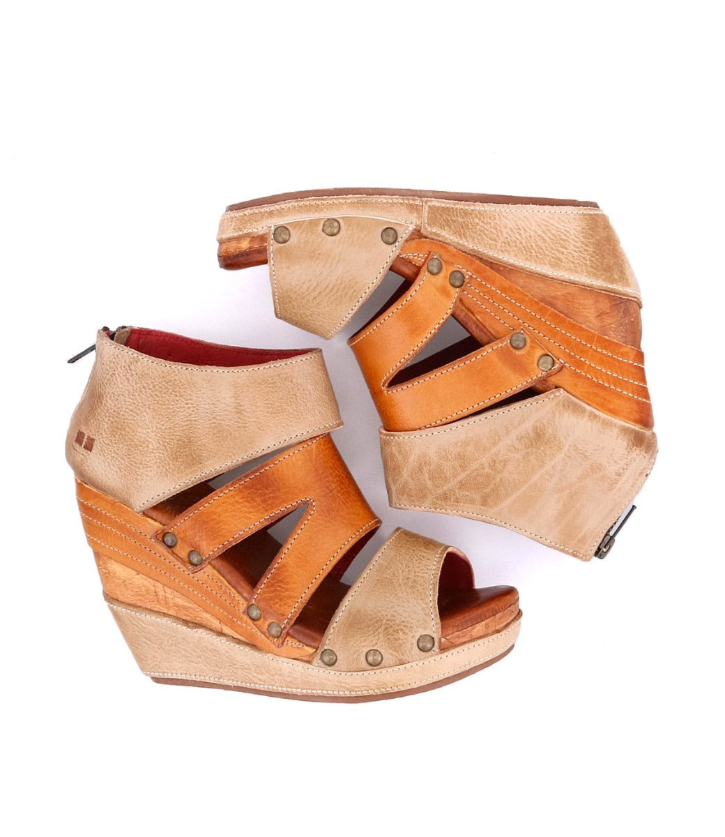 A pair of Bed Stu Jacey II women's wedge sandals with tan and brown straps.